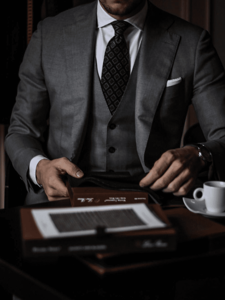 man wearing suit and tie